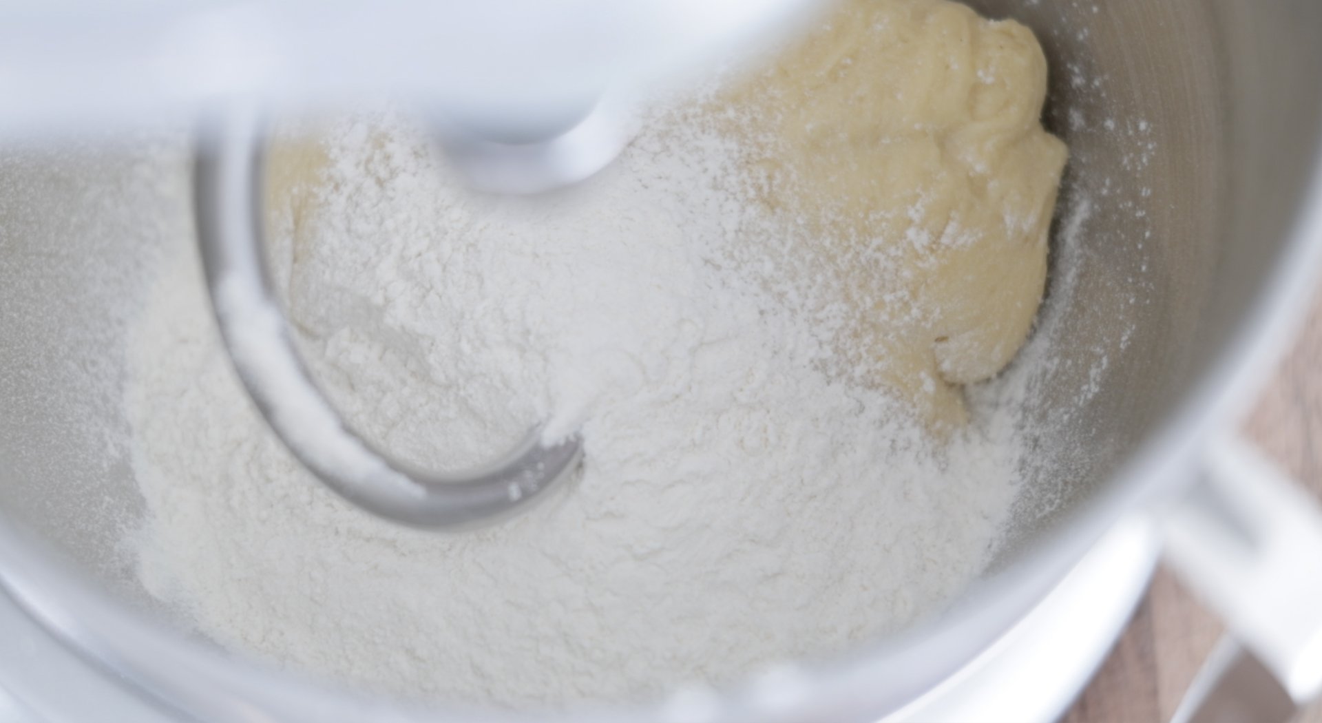 mixing flour with dough