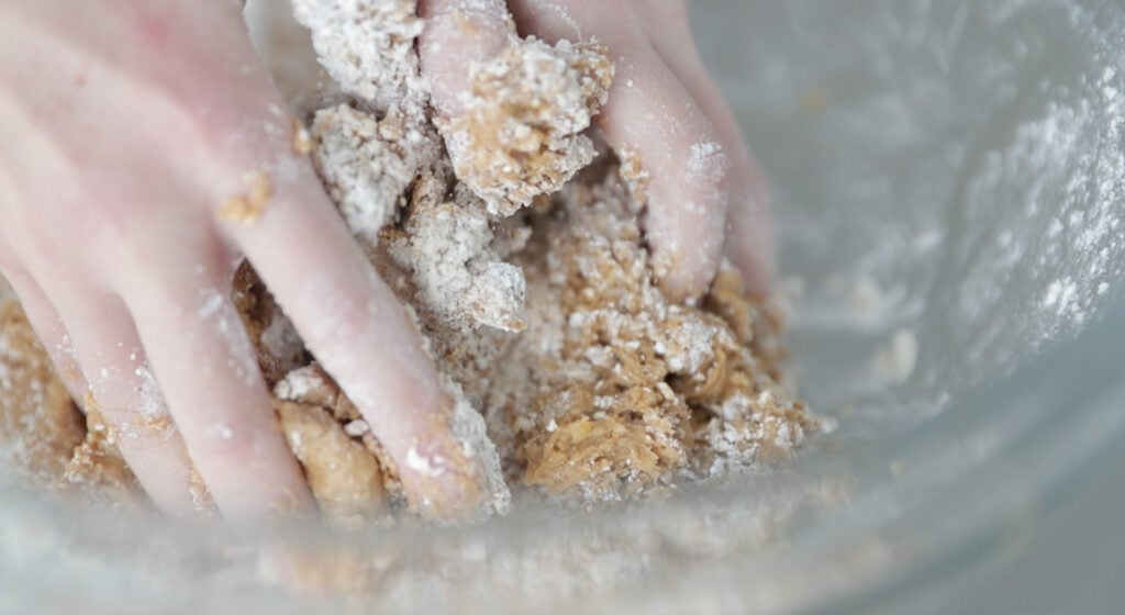 mix the crushed corn flakes, peanut butter, and powdered sugar