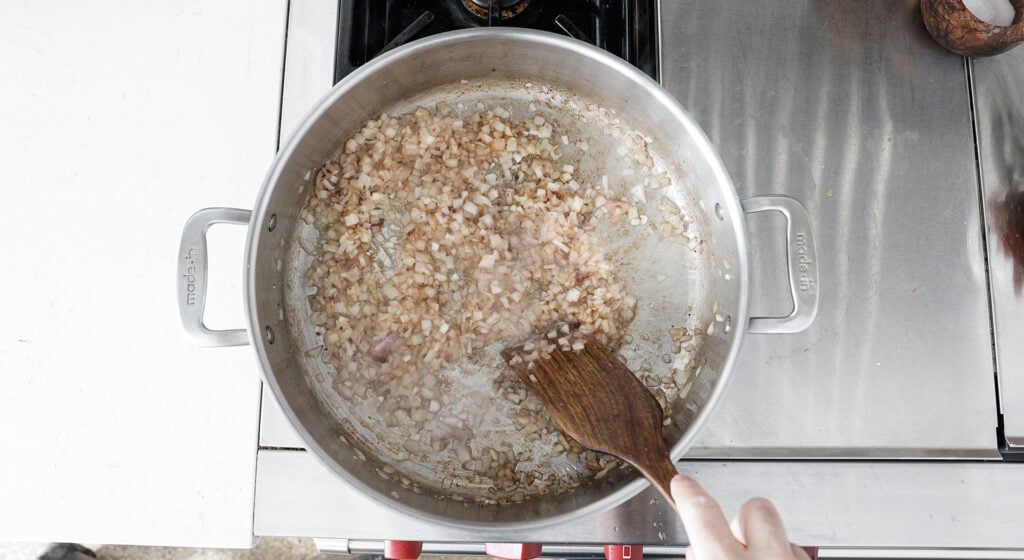 browned chopped shallots in pot