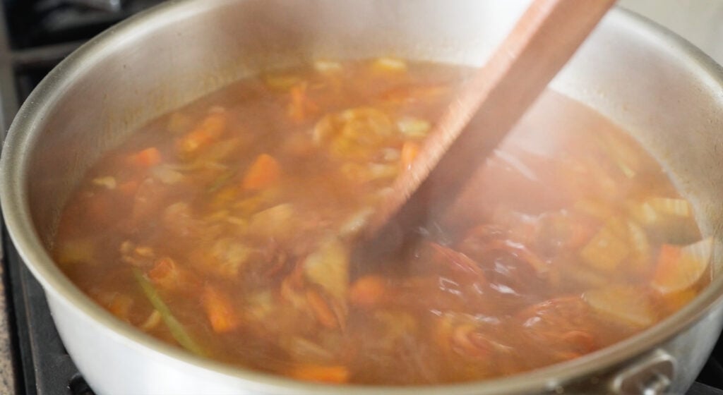 stirring pot of shrimp stock