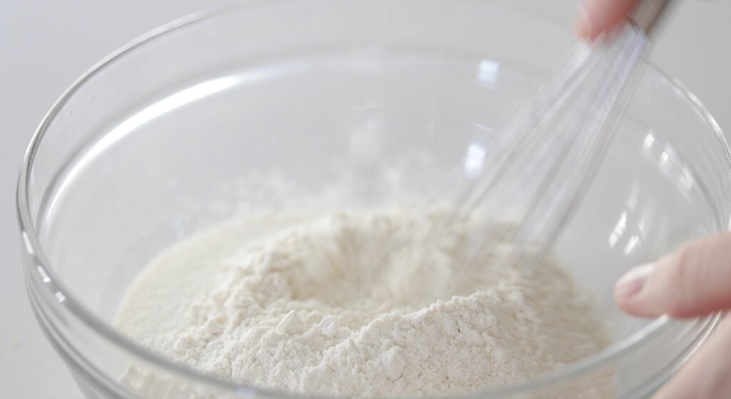 whisking together dry ingredients in a bowl
