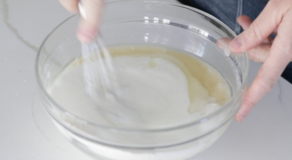 mixing buttermilk and oil in a bowl