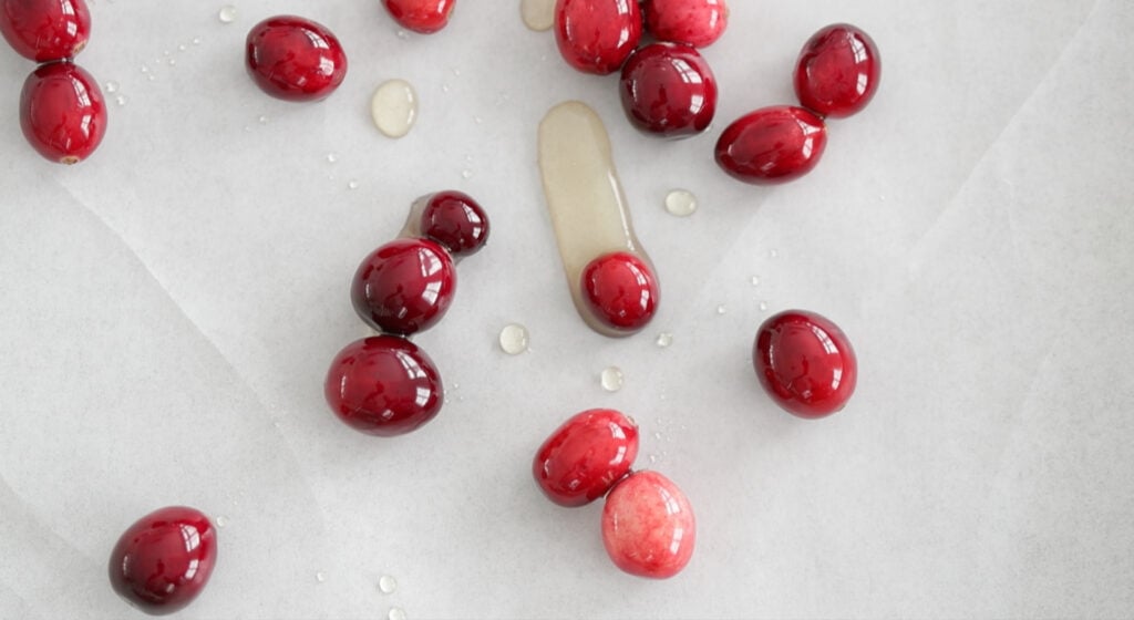 cranberries on parchment lined cookie sheet tray