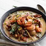 Bowl of Tom Yum Soup with shrimp on top