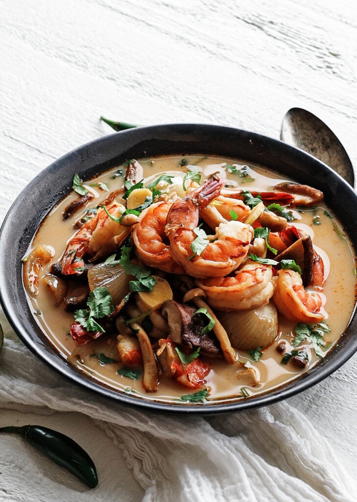 Bowl of Tom Yum Soup with shrimp on top