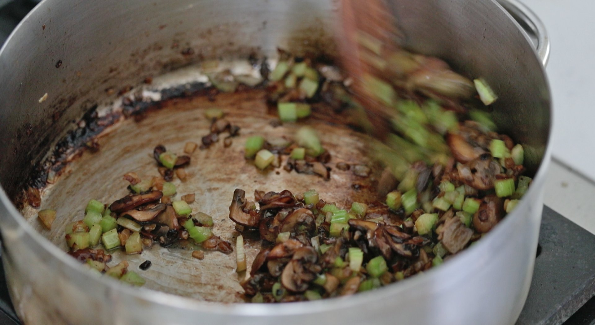 cooked mushrooms and celery in a pan