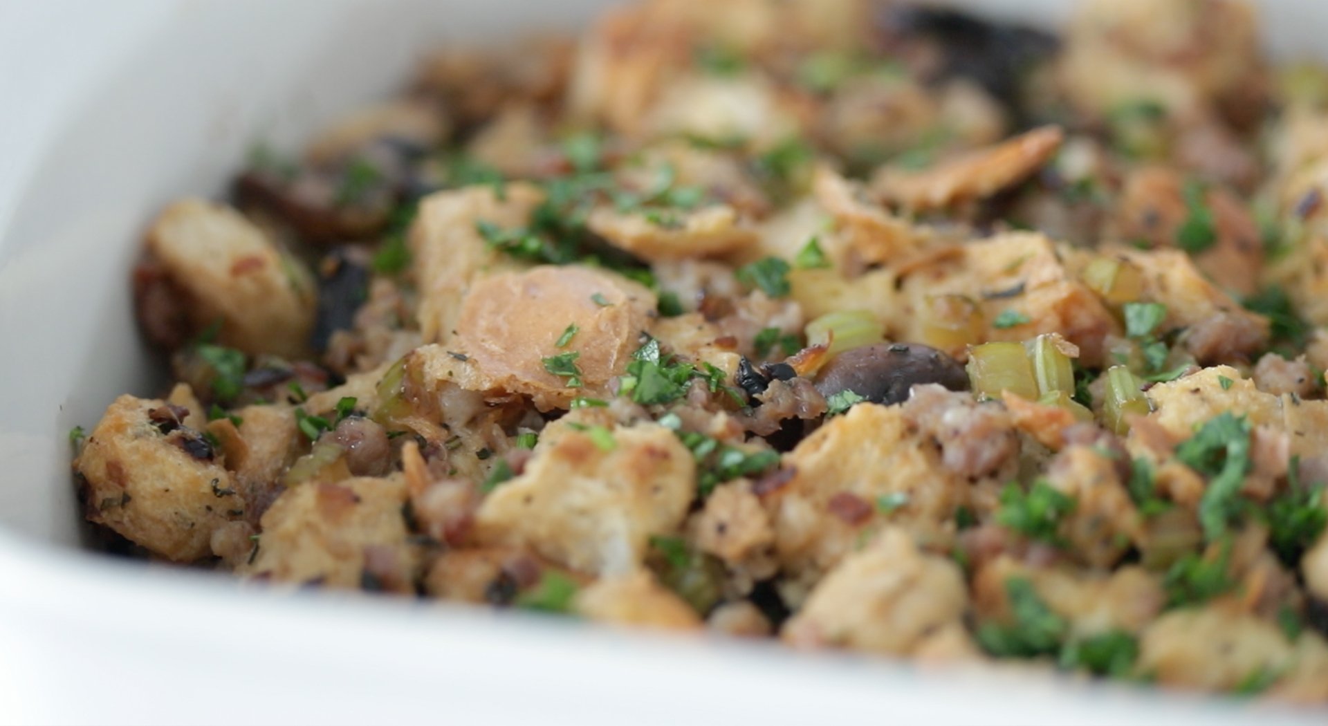 garnishing stuffing with fresh chopped herbs