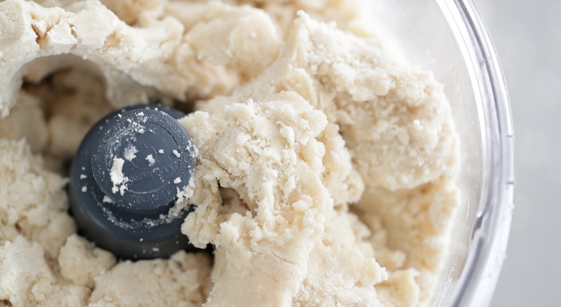 pulsing the pie crust dough in a food processor