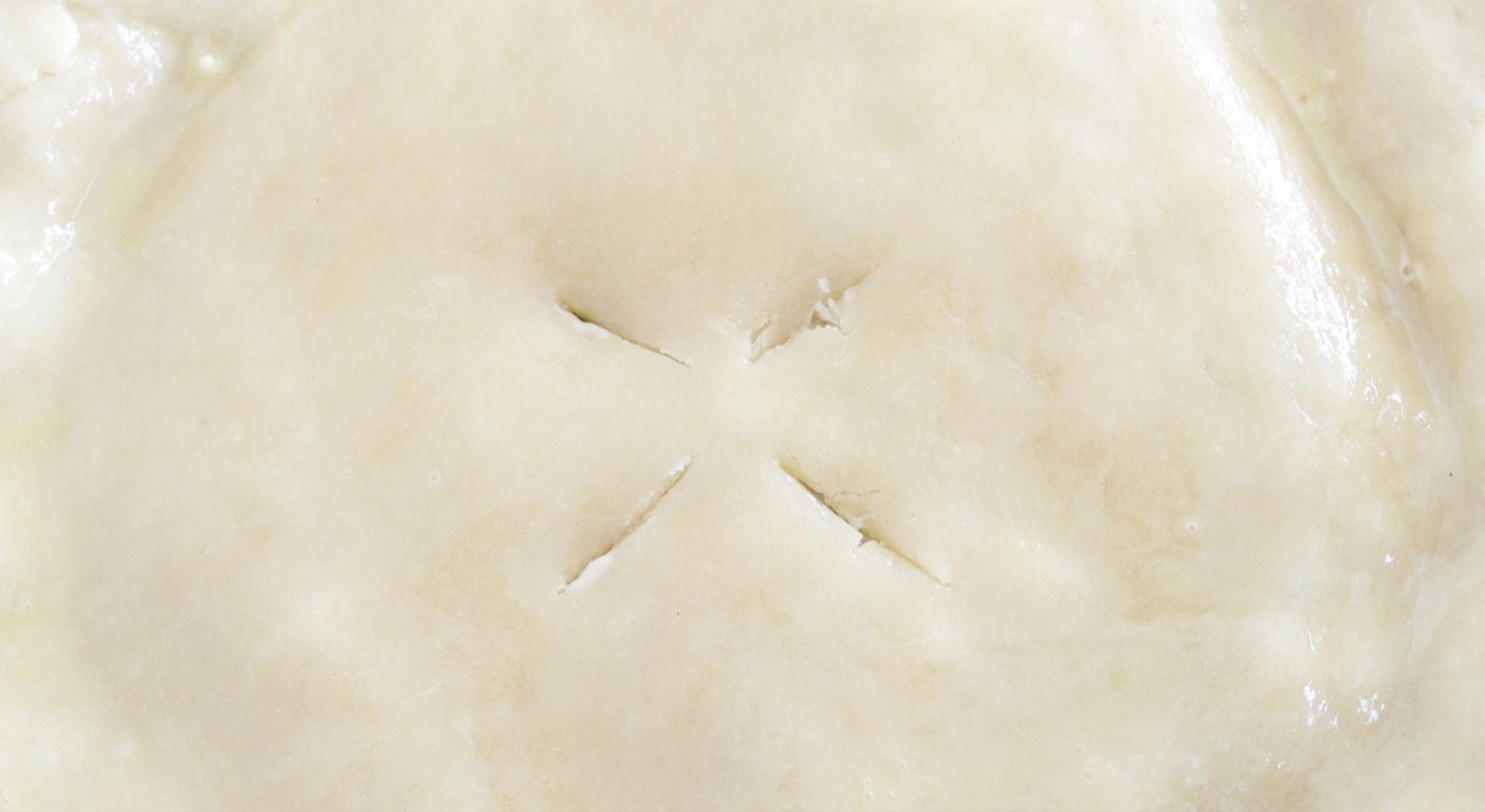 cutting slits into a pot pie