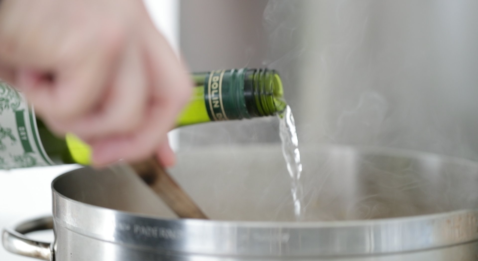 adding vermouth to a pot