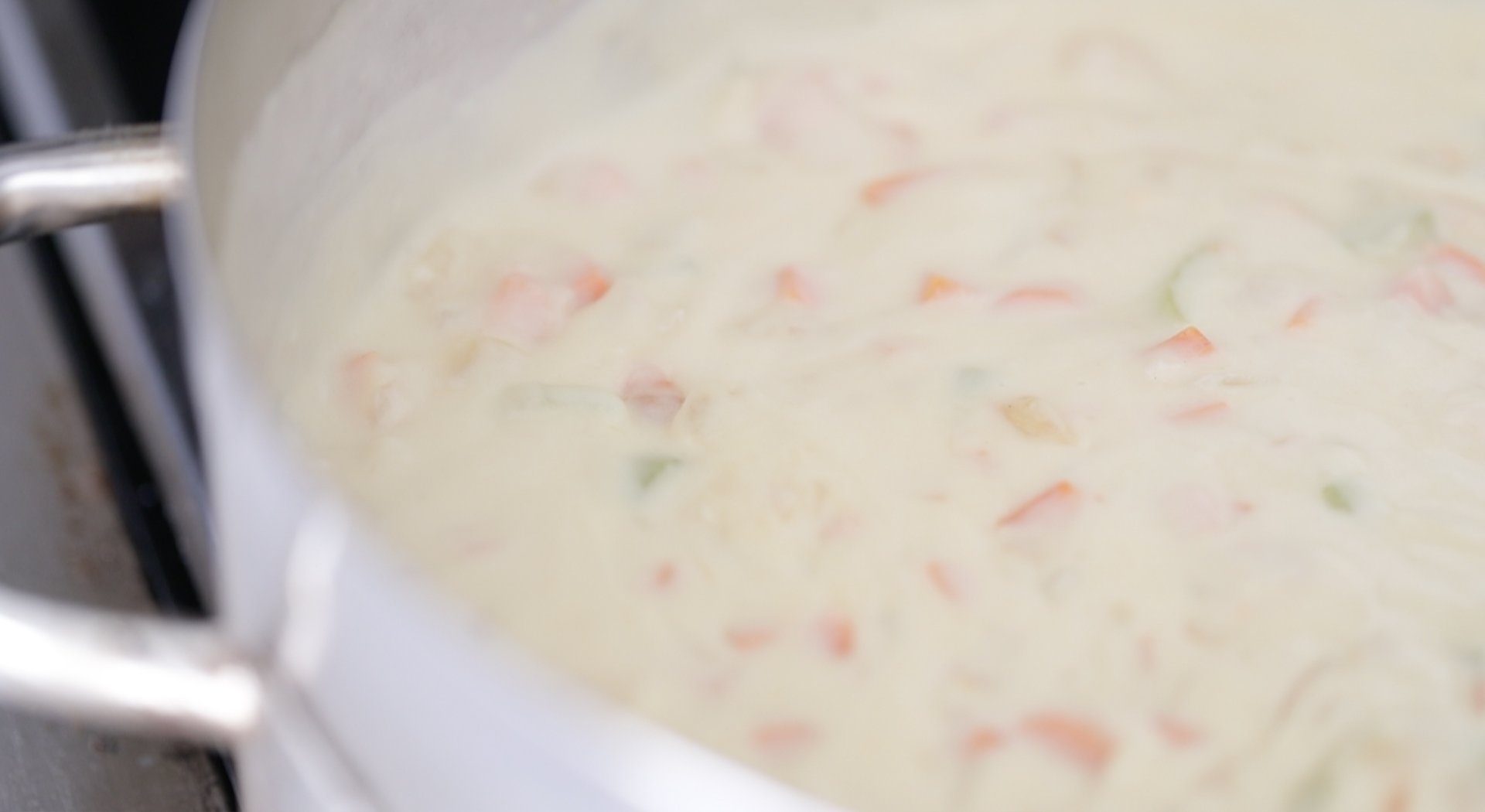 adding cream to a vegetable gravy