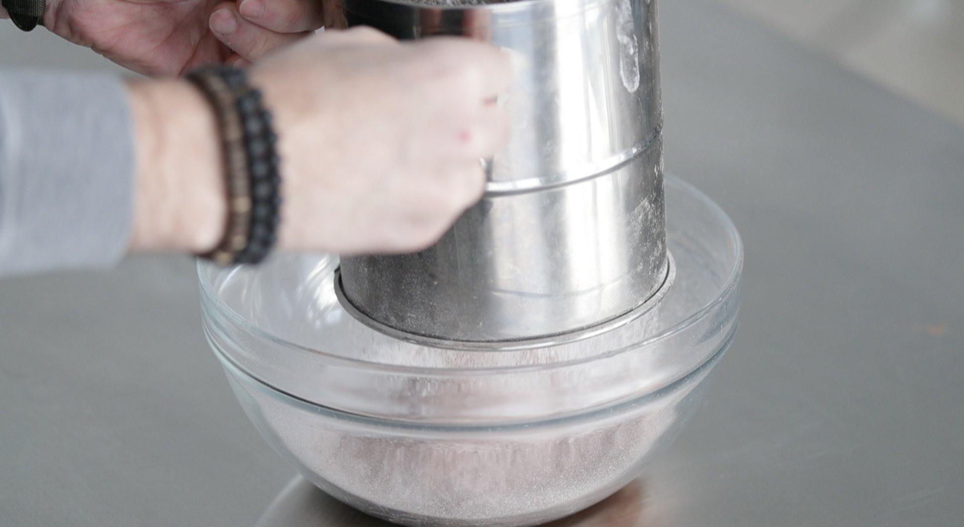 sifting flour into a bow