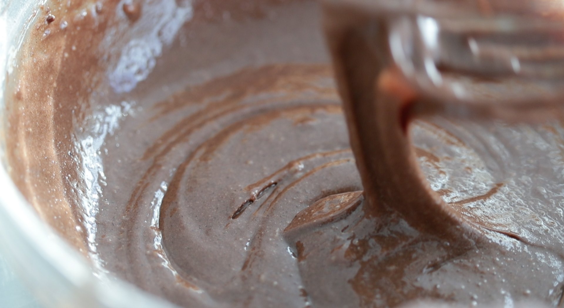 whisking together a chocolate batter