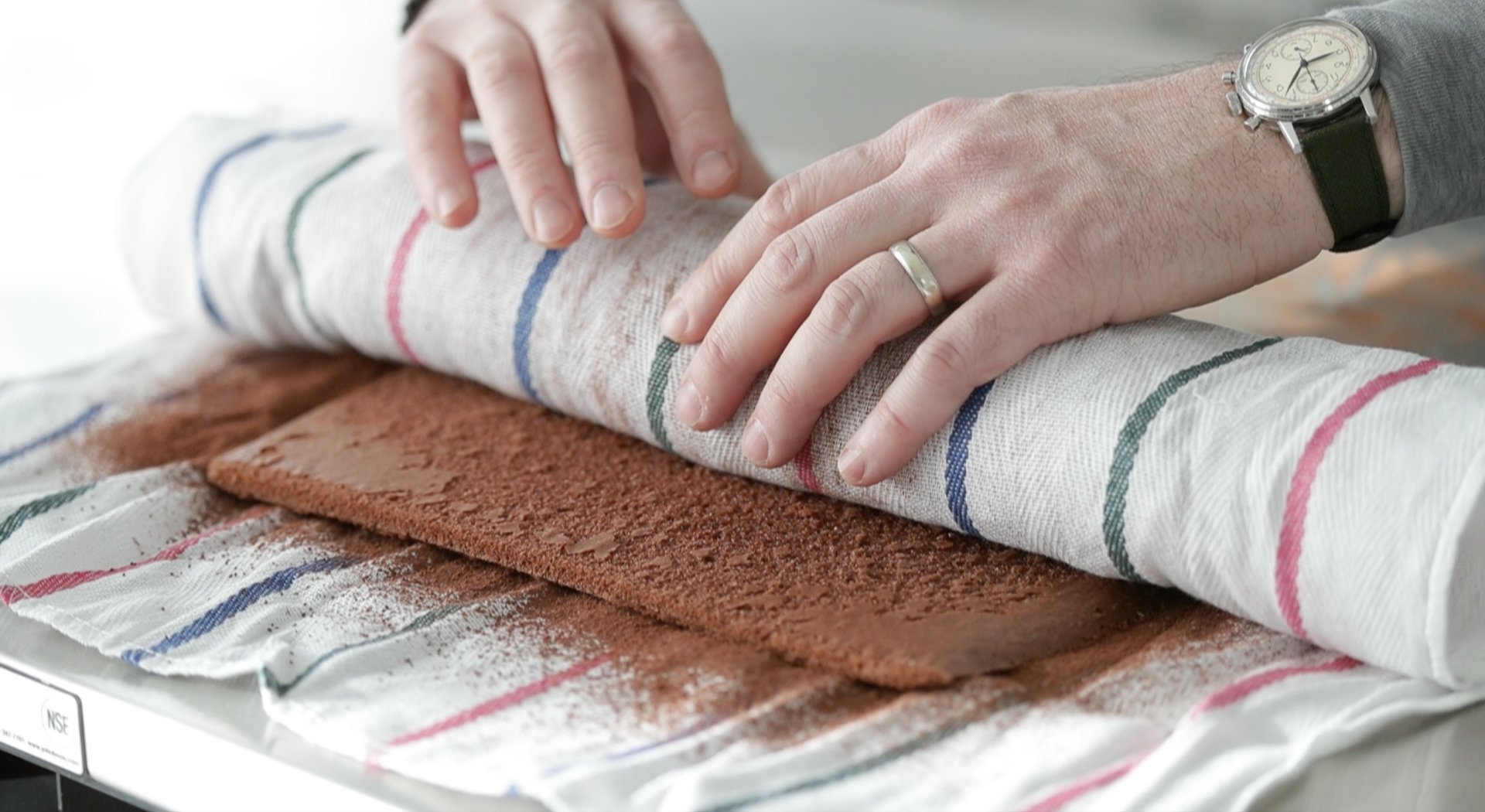 rolling up a chocolate cake