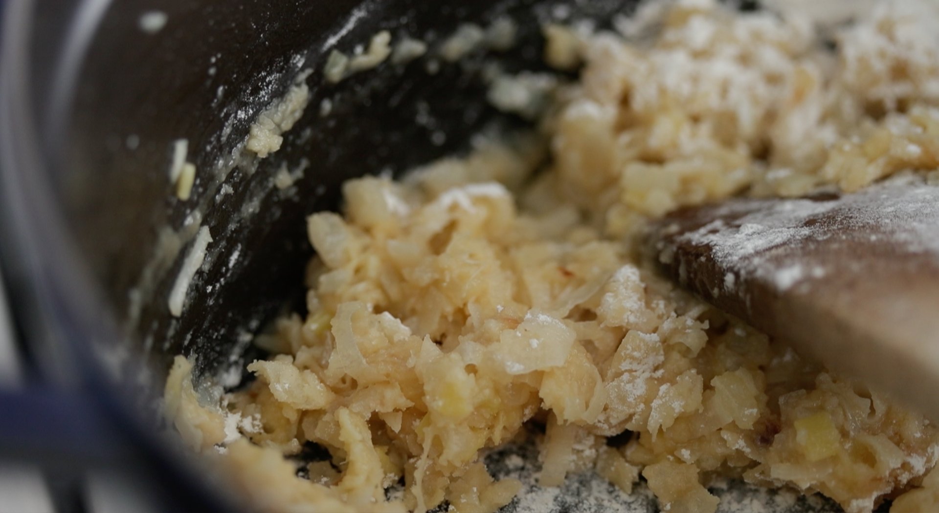 stirring flour and onions to make a roux