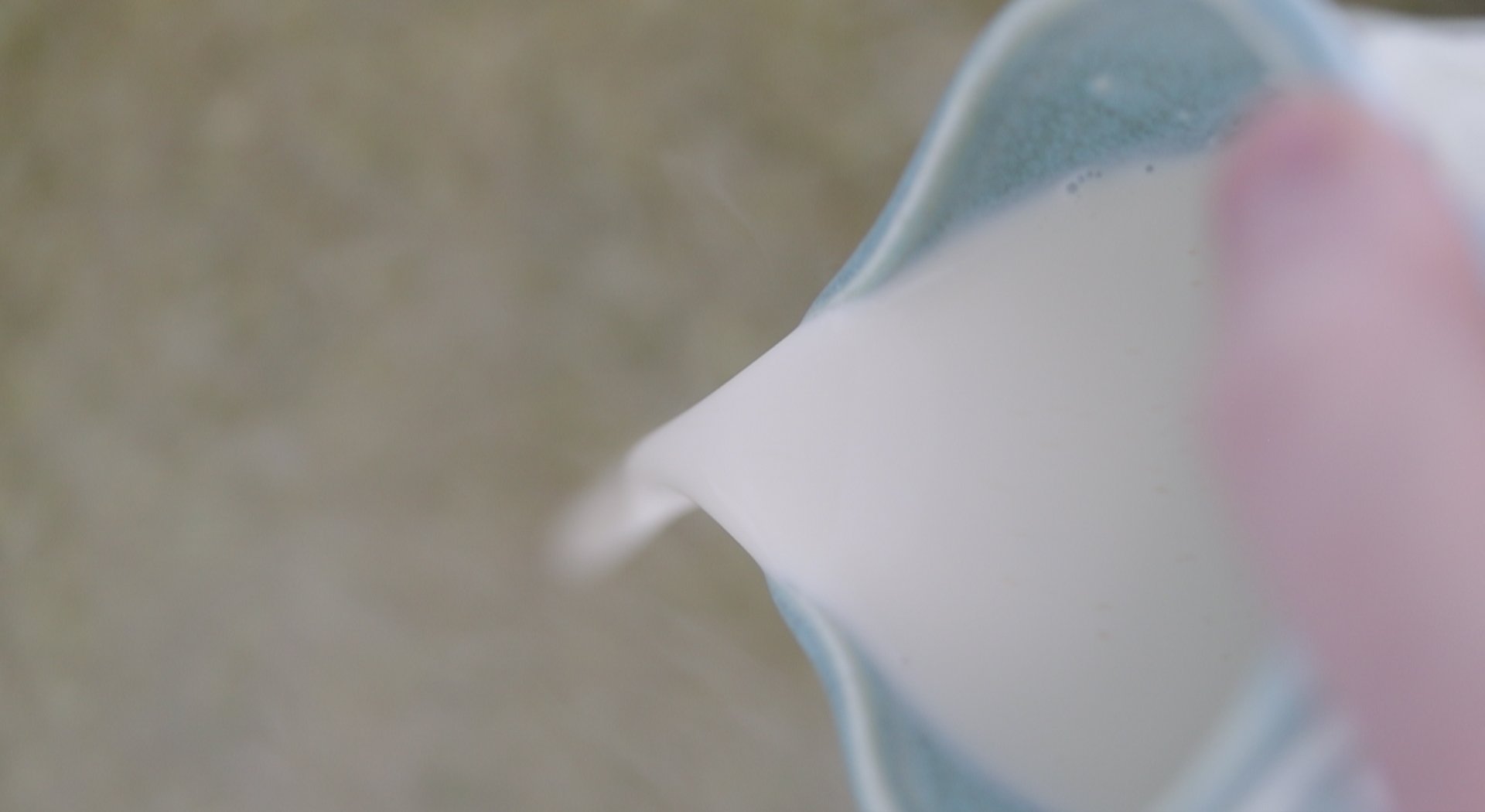 adding cream to a soup