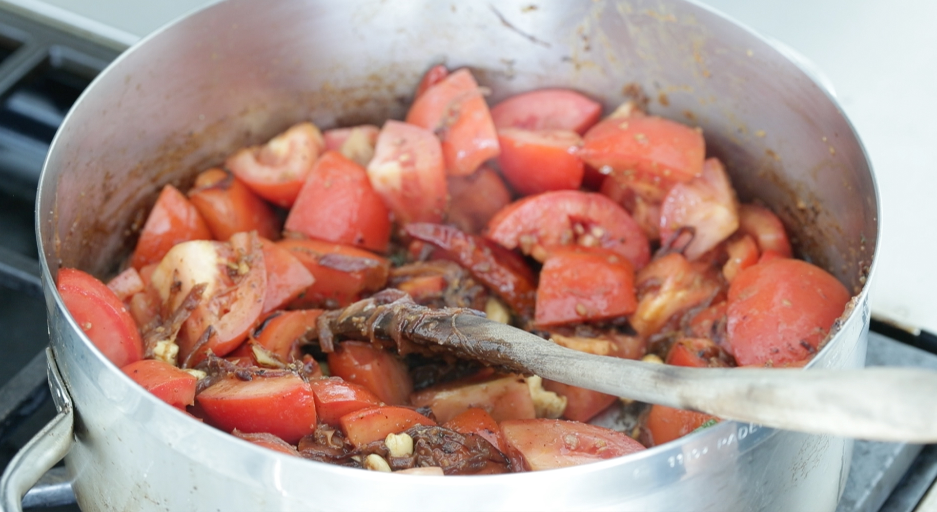 cooking tomatoes with onions and peppers