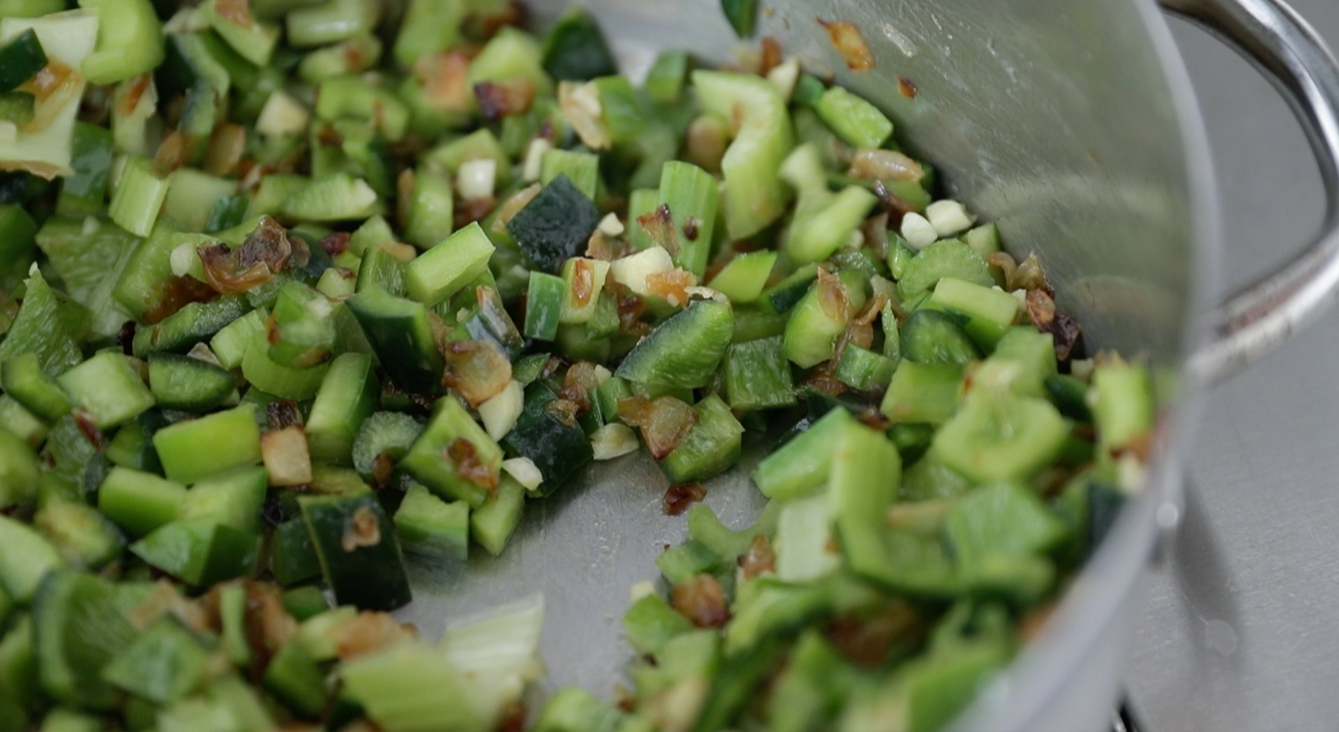 cooking peppers and onions