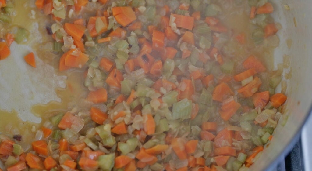 deglazing with white wine in a pot with vegetables