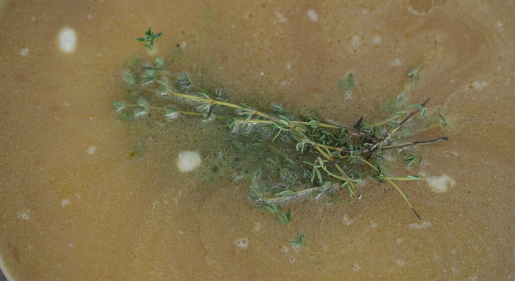 cooking a ham and bean soup in a pot