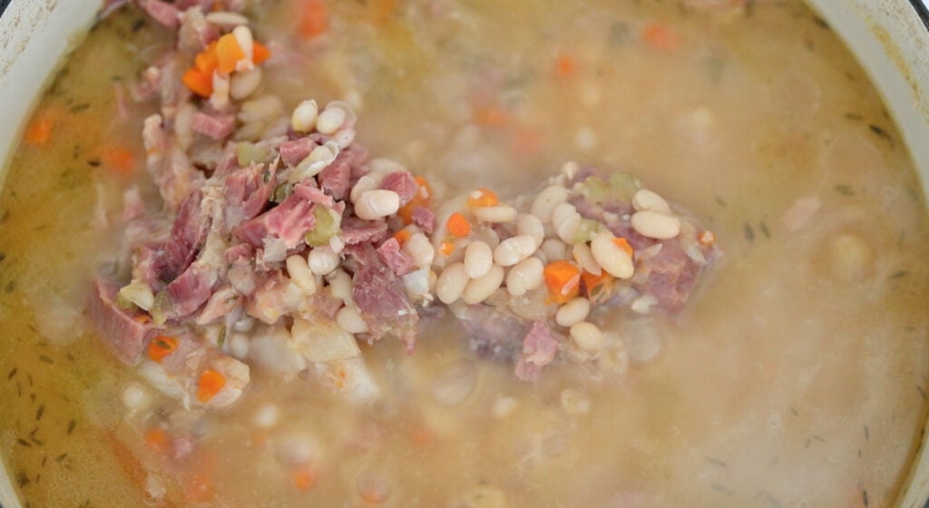 finished ham and bean soup with a ham hock
