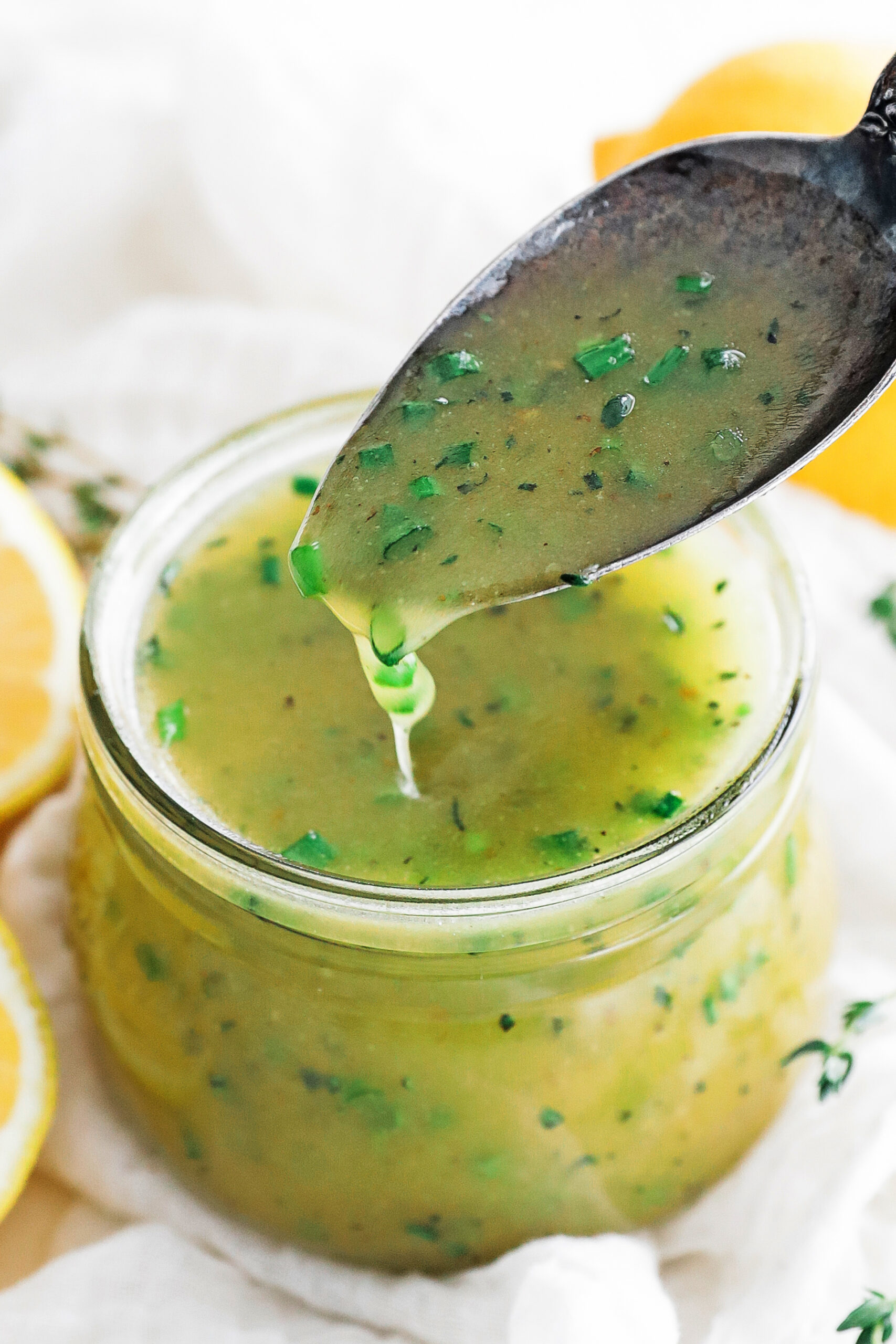 spoonful of lemon vinaigrette in a jar