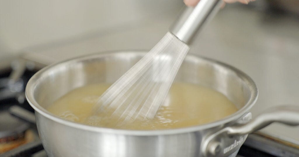 whisking dashi in a pot
