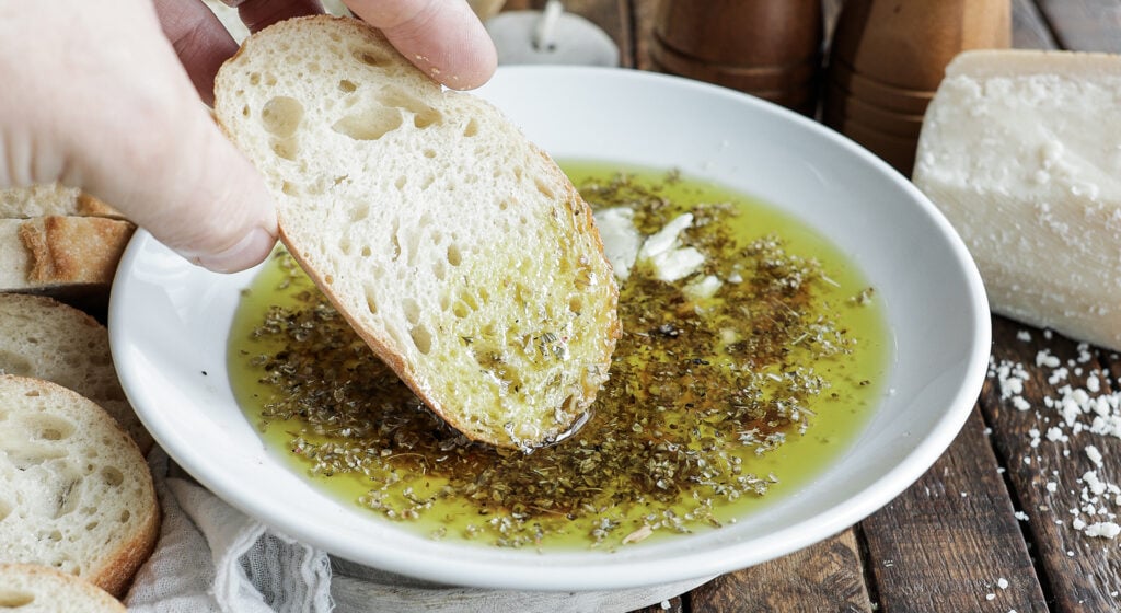 dipping bread in olive oil