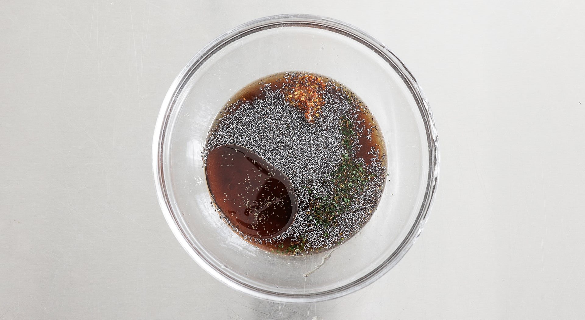 poppy seeds and vinegar in a bowl