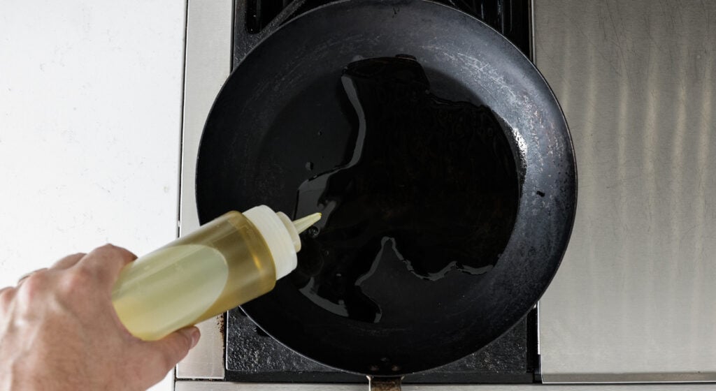 Pouring oil into a pan