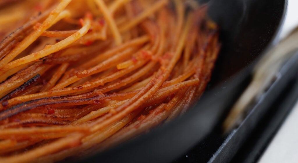 Pasta coated with tomato sauce