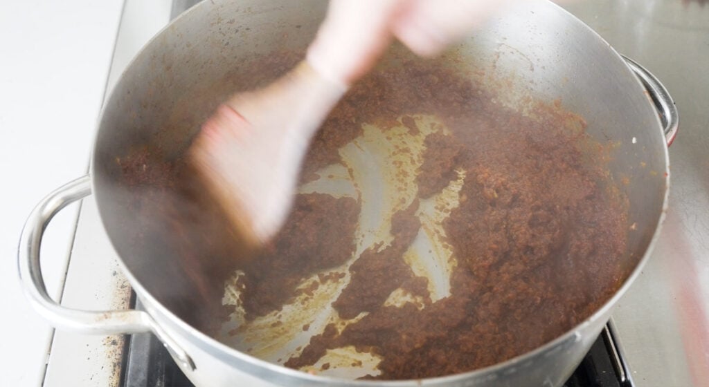 stirring ingredients in a pot
