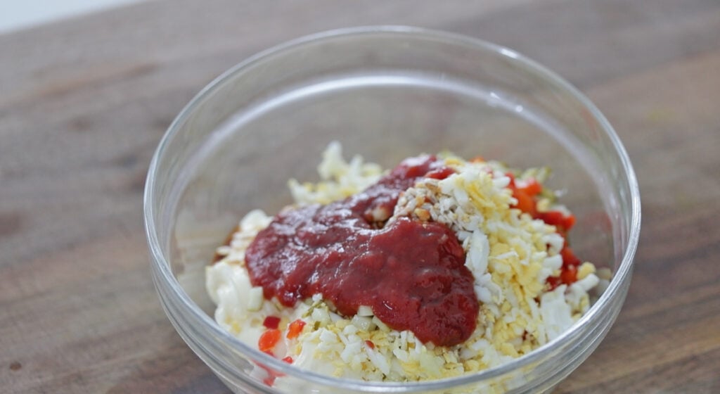 bowl of chopped hard boiled eggs and mayonnaise