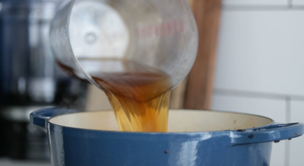 Adding in the beef stock to braise the beef