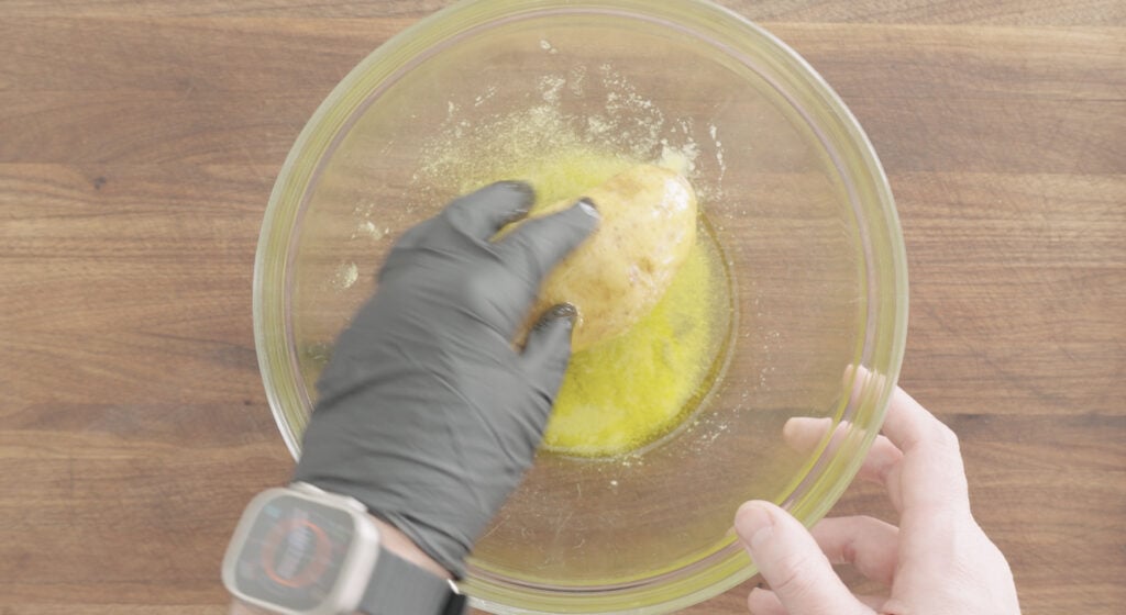 coating a potato in oil and salt