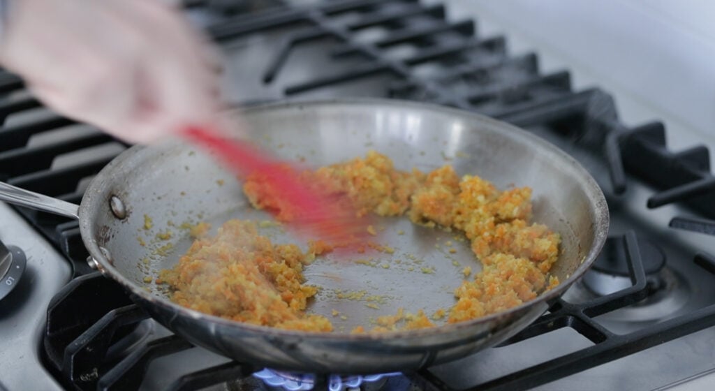 cooking mirepoix in a pan with oil