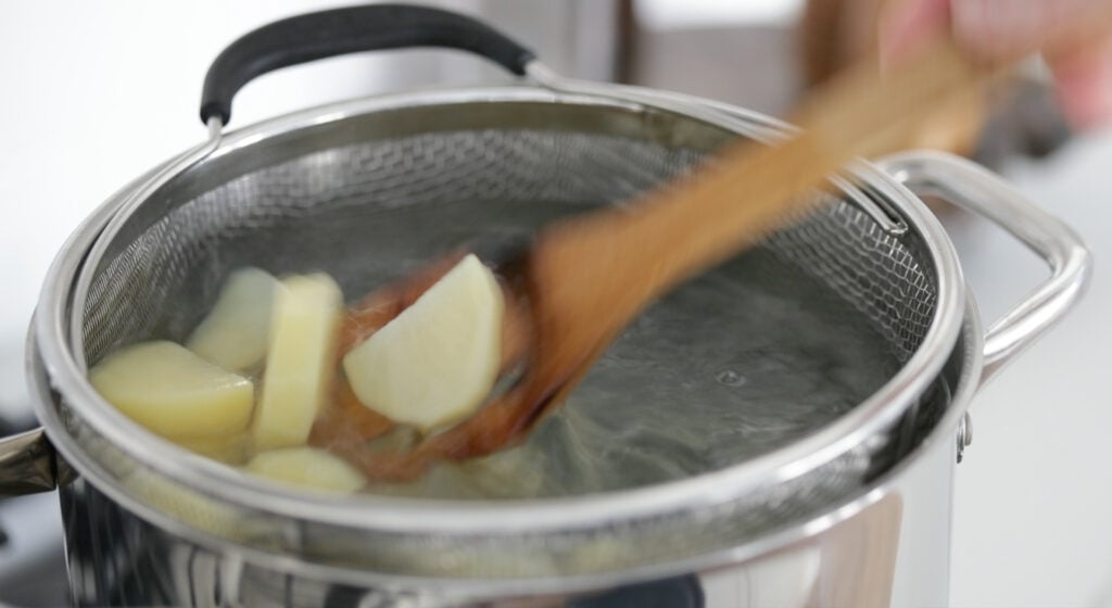 cooking potatoes in a pot of boiling water