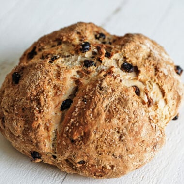 loaf of baked irish soda bread with raisins