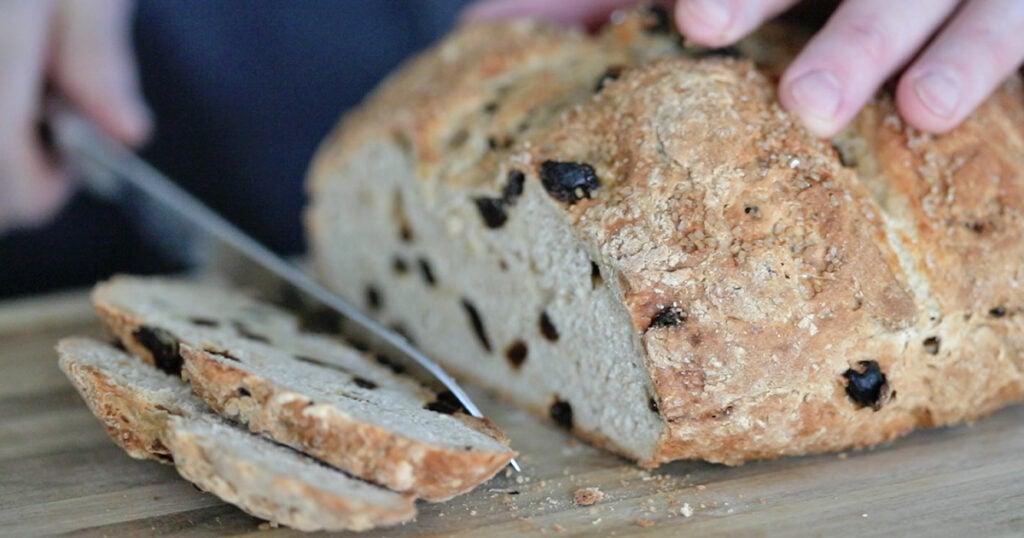 slicing Irish soda bread
