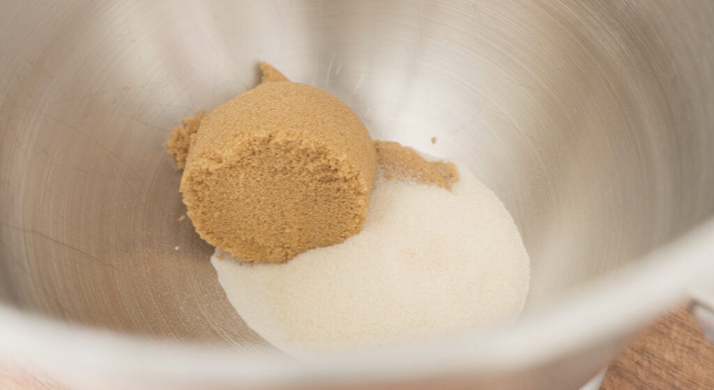 Brown and white sugar in a mixing bowl