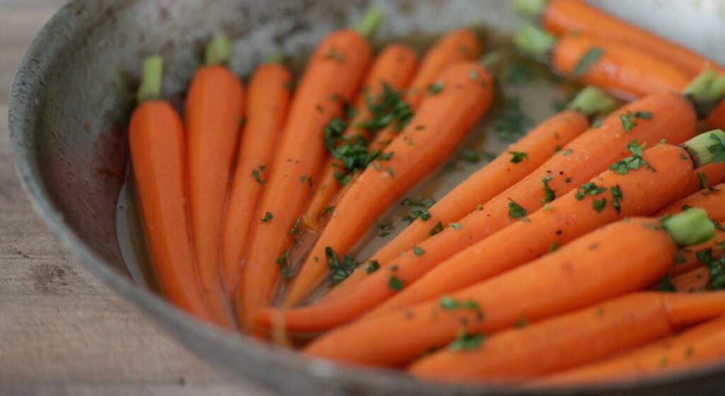 Tossing the carrots in the glaze