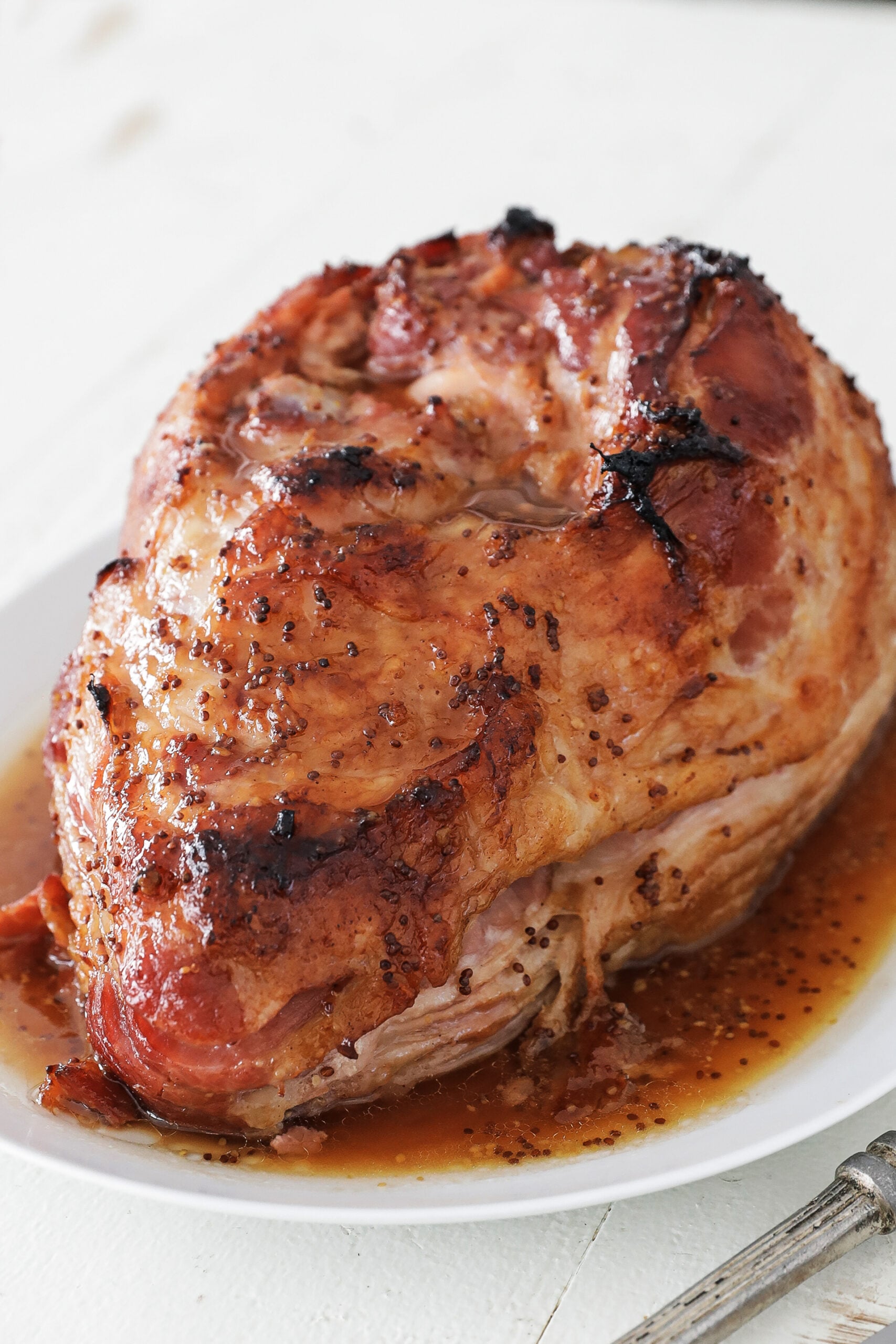 whole glaze ham on a platter