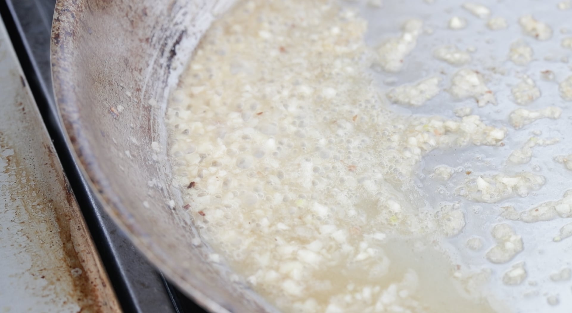 de-glazed white wine in a pan