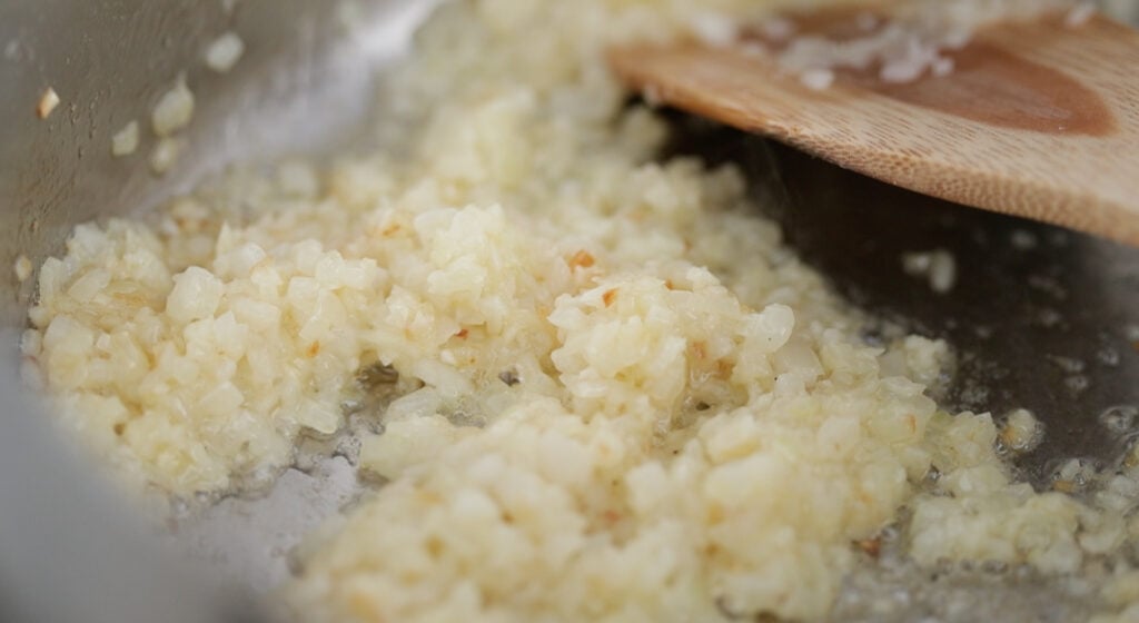 saut&eacute;ing garlic and onions in a large pot