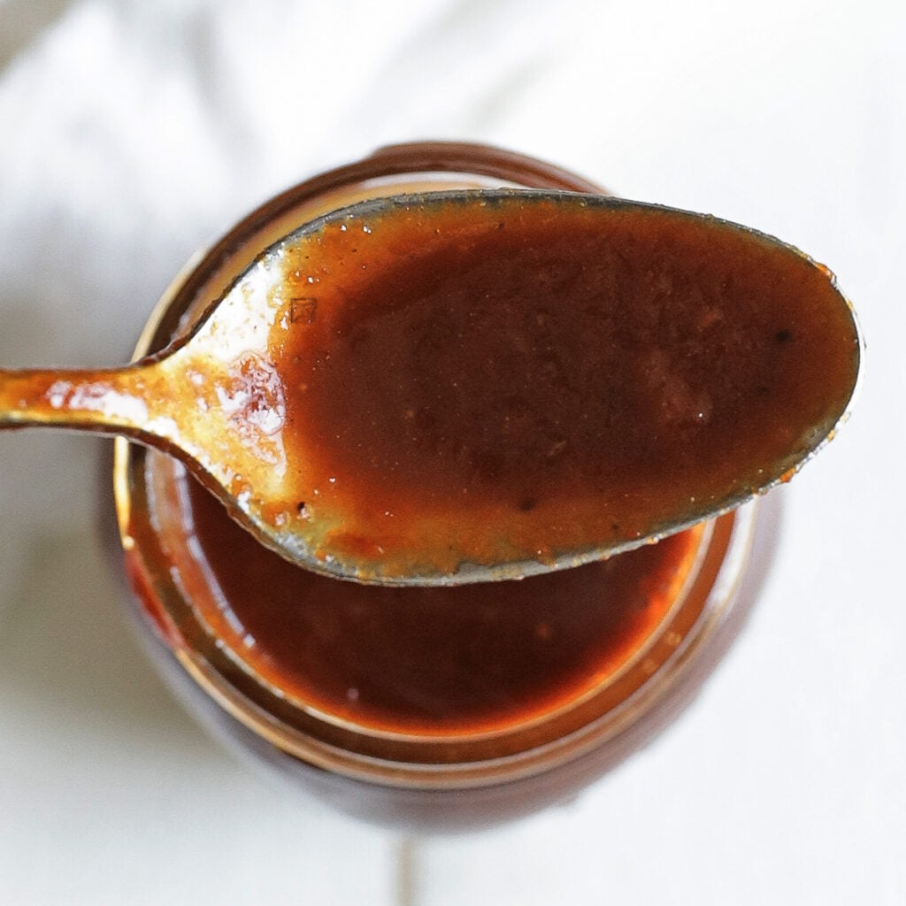 spoon with homemade bbq sauce in it