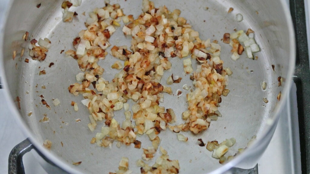 caramelizing onions and garlic in a pot