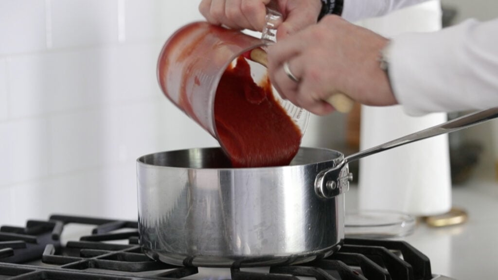 adding ketchup to the pot