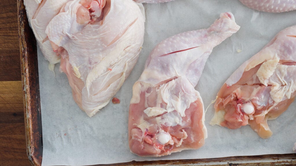 Close up of chicken pieces with slices in them