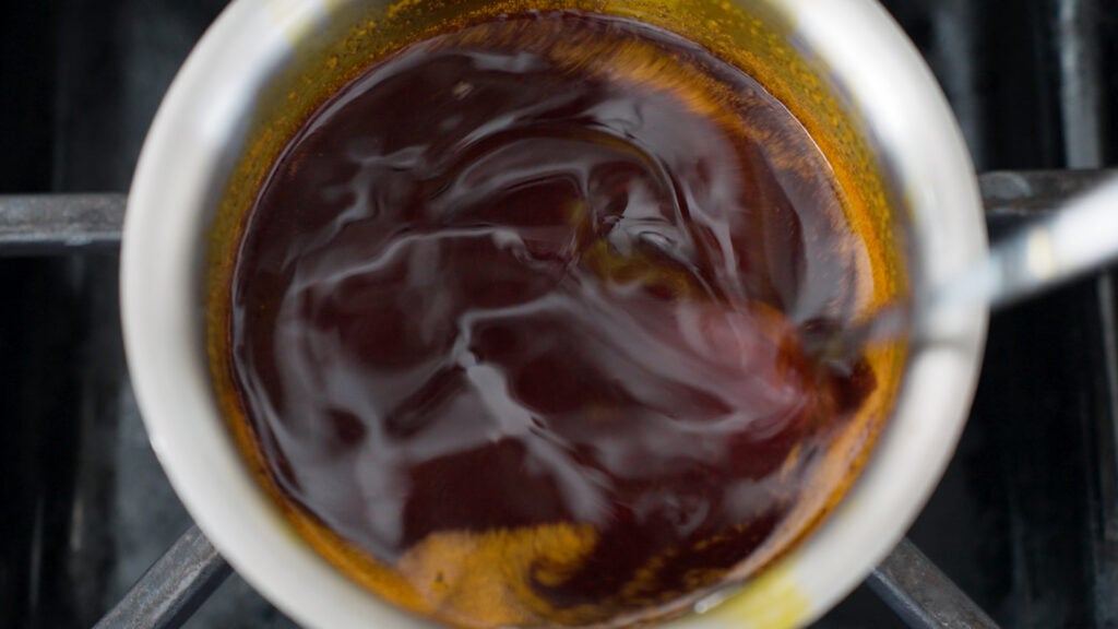 Small saucepot on the stove with basting sauce ingredients