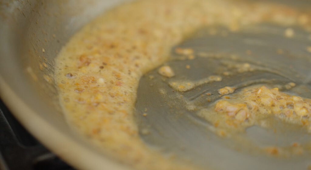 shallots and garlic browning in a pan with butter